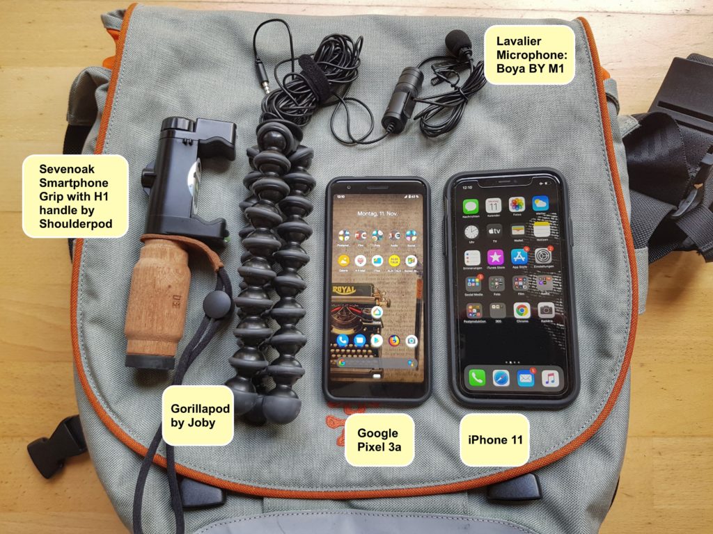 Mobile Journalism bag by Bernhard Lill, including an iPhone 11, a Galaxy S8, a Gorillapod by Joby, a lavalier microphone by Boya, a smartphone Grip form Sevenoaks and the H1 handle by Shoulderpod.